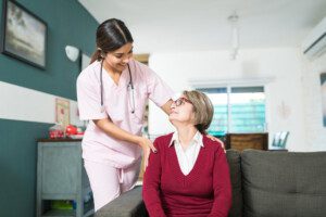 Senior woman talking with a nurse