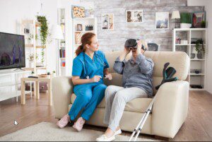 Senior woman uses virtual reality with a nurse