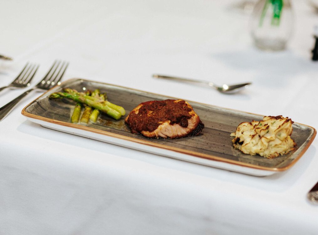 close-up of a beautifully plated upscale meal on rectangular plate