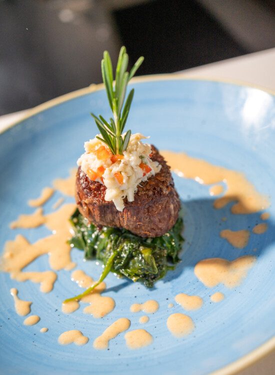 close-up of a beautifully plated, elegant steak dish at Harbour's Edge Senior Living Community