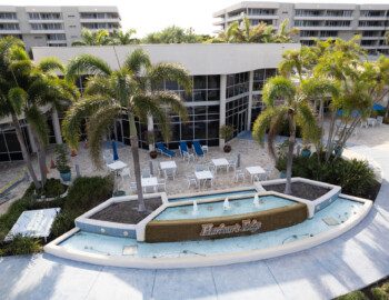 DJI 0087 beautiful fountain and palm trees outside of a lounge area at Harbour's Edge Senior Living Community
