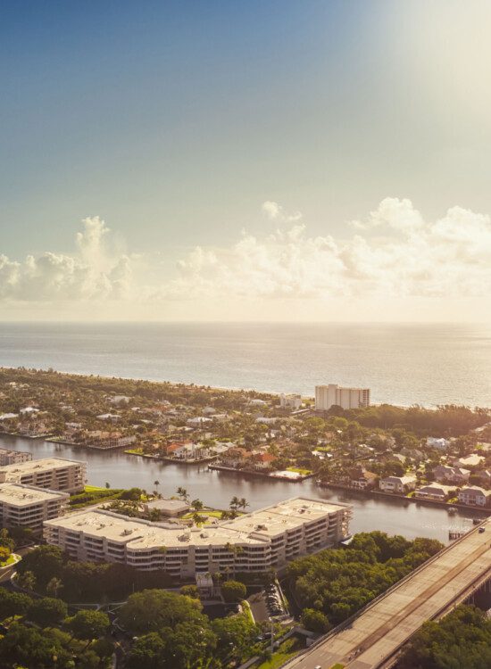 elevated, panoramic of Harbour's Edge Senior Living Community in Delray Beach, FL, pressed against the water at Delray Beach, FL